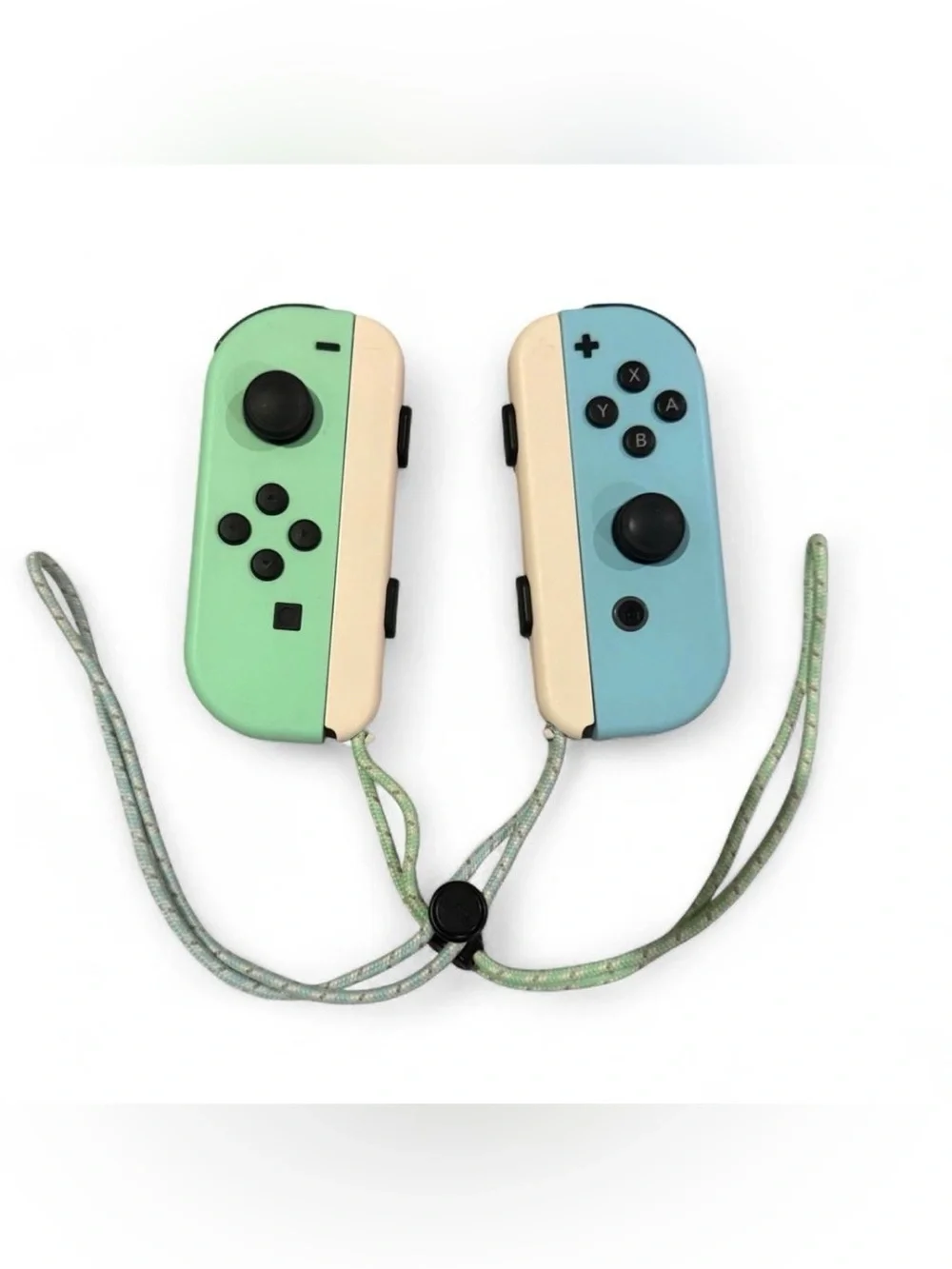 Nintendo Switch with Mint Green Left and Light Blue Right Joy‑Con